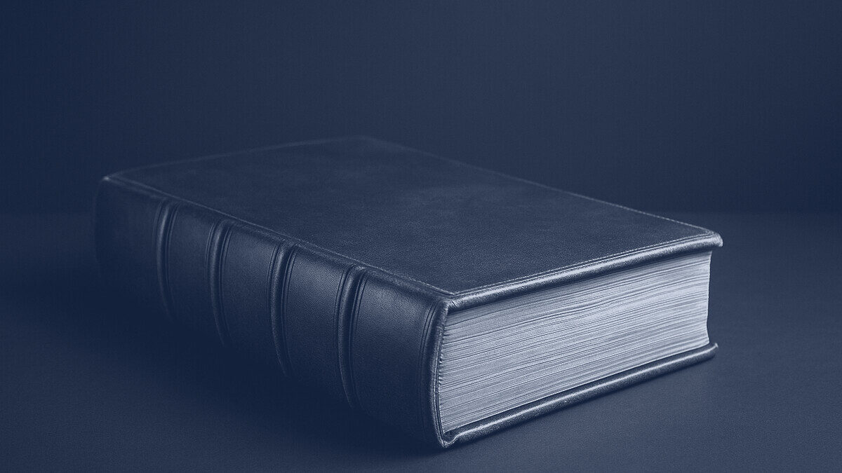 A leather-bound ledger on a dark surface